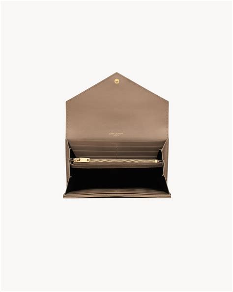 CASSANDRE MATELASSÉ large flap wallet in .